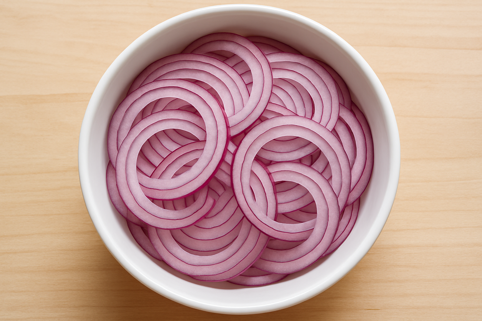 Sliced red onion in a bowl